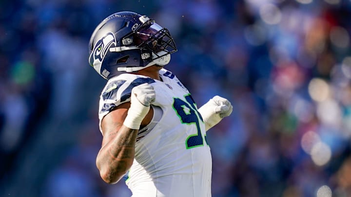 Seattle Seahawks defensive end Leonard Williams (99) celebrates sacking Tennessee Titans quarterback Cam Ward (1) during the third quarter at Nissan Stadium in Nashville, Tenn., Sunday, Nov. 23, 2025.
