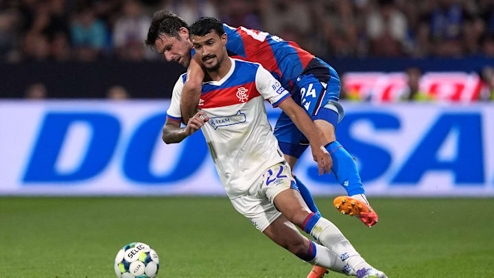 The Palmeiras-bound Jefte battling for the ball in what could prove to be his final Rangers appearance.