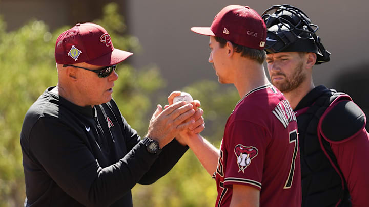 Arizona Diamondbacks pitching coach Brent Strom works with pitcher Luke Weaver during spring training workouts at Salt River Fields.