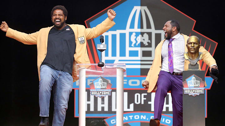 Ray Lewis (right), and his former Ravens teammate Jonathan Ogden during Lewis' speech at the Pro Football Hall of Fame.