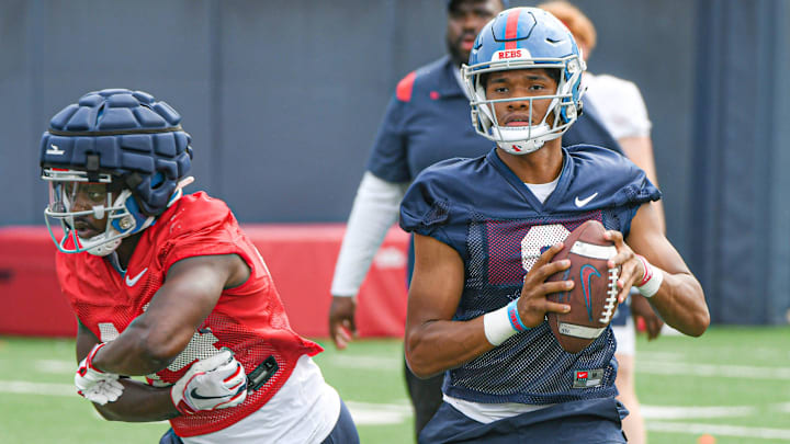 Quarterback Austin Simmons (8) throws a pass at Ole Miss football practice in Oxford, Miss., on Friday, Aug. 11, 2023. Quarterback Austin Simmons (8) throws a pass at Ole Miss football practice in Oxford, Miss., on Friday, Aug. 11, 2023.