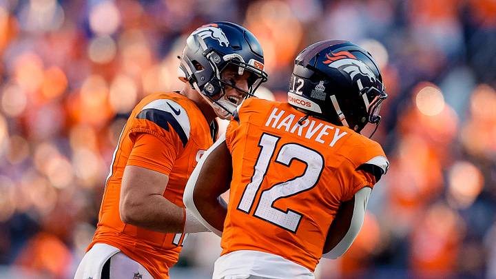 Oct 19, 2025; Denver, Colorado, USA; Denver Broncos quarterback Bo Nix (10) celebrates the touchdown of running back RJ Harvey (12) in the fourth quarter against the New York Giants at Empower Field at Mile High.