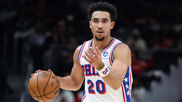 Dec 14, 2025; Atlanta, Georgia, USA; Philadelphia 76ers guard Jared McCain (20) dribbles and signals to teammates during the game against the Atlanta Hawks in the first quarter at State Farm Arena. Mandatory Credit: Jordan Godfree-Imagn Images