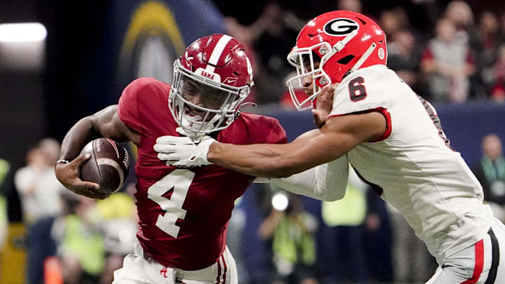 Dec 2, 2023; Atlanta, GA, USA; Georgia Bulldogs defensive back Daylen Everette (6) tackles Alabama Crimson Tide quarterback Jalen Milroe (4) at Mercedes-Benz Stadium. Mandatory Credit: Gary Cosby Jr.-Imagn Images Dec 2, 2023; Atlanta, GA, USA; Georgia Bulldogs defensive back Daylen Everette (6) tackles Alabama Crimson Tide quarterback Jalen Milroe (4) at Mercedes-Benz Stadium. Mandatory Credit: Gary Cosby Jr.-Imagn Images