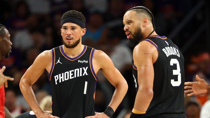 Apr 14, 2026; Phoenix, Arizona, USA; Phoenix Suns guard Devin Booker (1) and forward Dillon Brooks (3) against the Portland Trail Blazers during the play-in rounds of the 2026 NBA Playoffs at Mortgage Matchup Center. Mandatory Credit: Mark J. Rebilas-Imagn Images Apr 14, 2026; Phoenix, Arizona, USA; Phoenix Suns guard Devin Booker (1) and forward Dillon Brooks (3) against the Portland Trail Blazers during the play-in rounds of the 2026 NBA Playoffs at Mortgage Matchup Center. Mandatory Credit: Mark J. Rebilas-Imagn Images