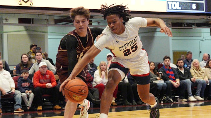 Stepinac's Jasiah Jervis (25) and Iona's Joe Wolf (11) battle for a loose ball during the Crusader Classic at the Westchester County Center in White Plains Jan. 4, 2025.