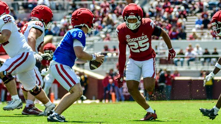 Oklahoma safety Michael Boganowski chases after quarterback Bowe Bentley during the spring game.