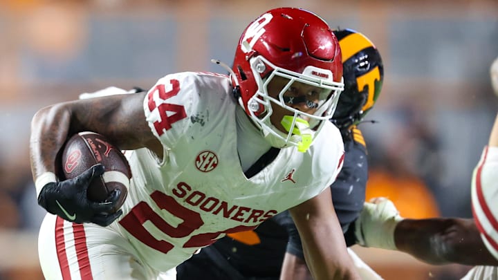 Oklahoma Sooners running back Xavier Robinson (24) runs the ball against the Tennessee Volunteers during the second half at Neyland Stadium. 