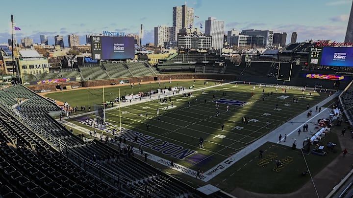 Nov 30, 2024; Chicago, Illinois, USA;  Teams warm up before the game between Northwestern Wildcats and Illinois Fighting Illini at Wrigley Field. Mandatory Credit: Matt Marton-Imagn Images