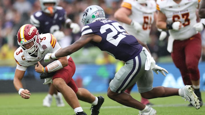 Aug 23, 2025; Dublin, IRELAND; Iowa State quarterback Rocco Becht is tackled by Zashon Rich of Kansas State during the Aer Lingus Classic between Iowa State and Kansas State at Aviva Stadium. Mandatory Credit: Laszlo Geczo/INPHO via Imagn Images