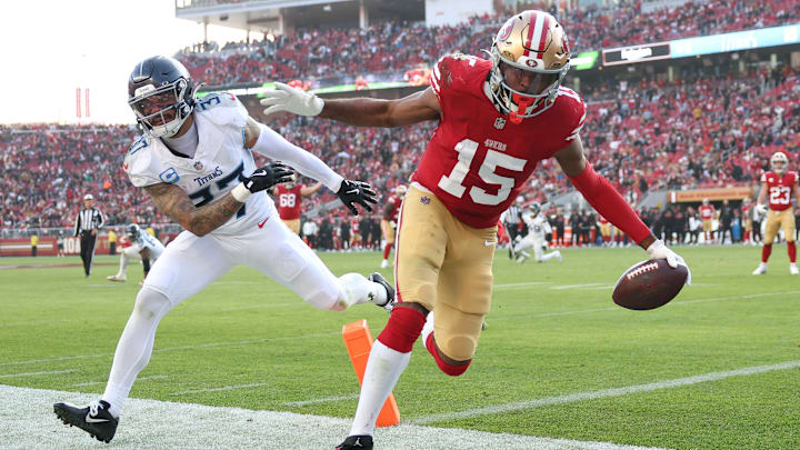 Tennessee Titans defensive back Amani Hookier (L) misses a tackle on San Francisco 49ers wide receiver Jauan Jennings (R) Tennessee Titans defensive back Amani Hookier (L) misses a tackle on San Francisco 49ers wide receiver Jauan Jennings (R)
