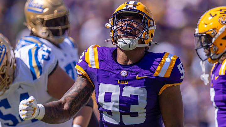 Sep 21, 2024; Baton Rouge, Louisiana, USA;  LSU Tigers defensive tackle Ahmad Breaux (93) reacts after sacking UCLA Bruins quarterback Ethan Garbers (4) during the first half at Tiger Stadium. Mandatory Credit: Stephen Lew-Imagn Images