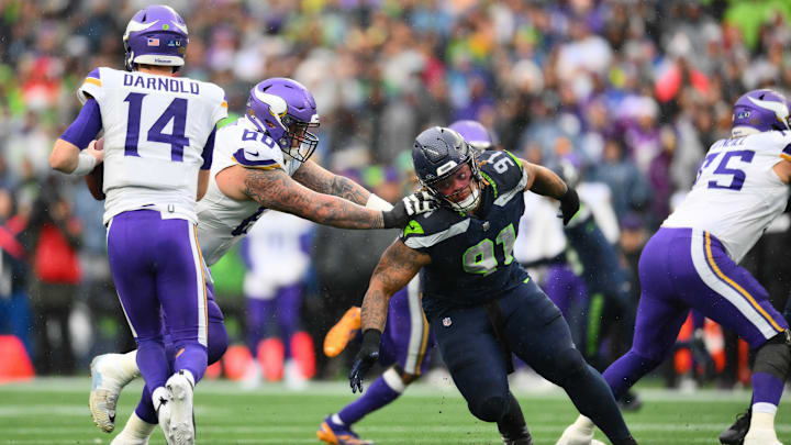 Dec 22, 2024; Seattle, Washington, USA; Minnesota Vikings guard Dalton Risner (66) blocks Seattle Seahawks defensive tackle Byron Murphy II (91) during the first half at Lumen Field. 
