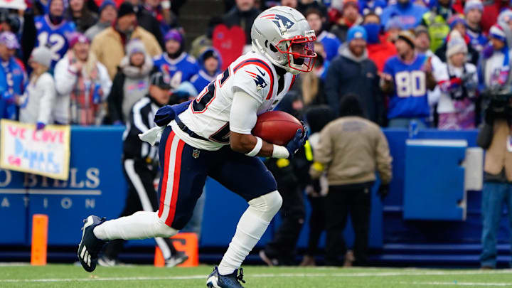 Jan 8, 2023; Orchard Park, New York, USA; New England Patriots cornerback Marcus Jones (25) returns a kick off against the Buffalo Bills during the first half at Highmark Stadium. Mandatory Credit: Gregory Fisher-USA TODAY Sports