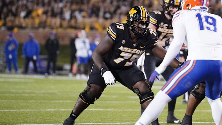 Nov 18, 2023; Columbia, Missouri, USA; Missouri Tigers offensive lineman Armand Membou (79) at the line of scrimmage against the Florida Gators during the game at Faurot Field at Memorial Stadium. Mandatory Credit: Denny Medley-Imagn Images Nov 18, 2023; Columbia, Missouri, USA; Missouri Tigers offensive lineman Armand Membou (79) at the line of scrimmage against the Florida Gators during the game at Faurot Field at Memorial Stadium. Mandatory Credit: Denny Medley-Imagn Images