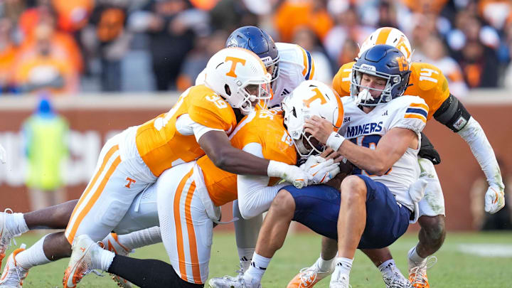 Nov 23, 2024; Knoxville, Tennessee, USA; Tennessee Volunteers defensive lineman Joshua Josephs (19) and linebacker Jalen Smith (39) sack UTEP Miners quarterback JP Pickles (19) at Neyland Stadium. Mandatory Credit: Angelina Alcantar/USA TODAY Network via Imagn Images