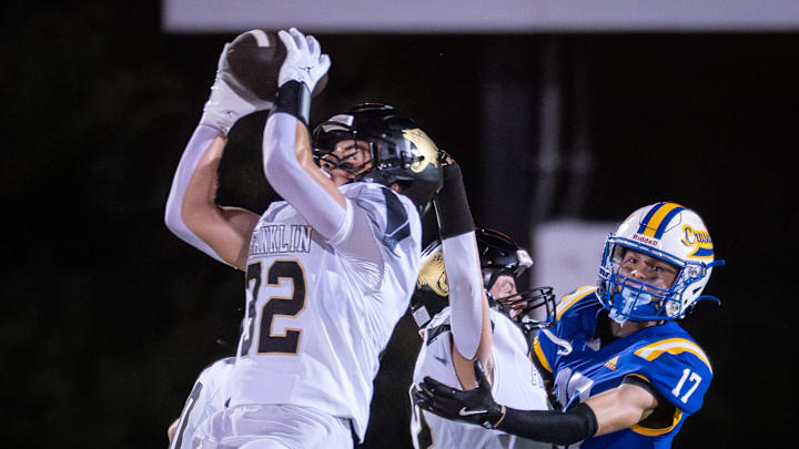 Franklin defensive back Dominick Walters (32) goes up for an interception in a season-opening non-conference game versus Catholic Memorial on Friday, August 22, 2025, at Schneider Stadium in Waukesha, Wisconsin.