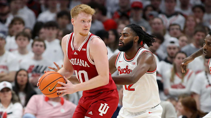Indiana Hoosiers forward Luke Goode (10) looks to pass as Ohio State Buckeyes guard Evan Mahaffey (12) defends during the second half at Value City Arena. Indiana Hoosiers forward Luke Goode (10) looks to pass as Ohio State Buckeyes guard Evan Mahaffey (12) defends during the second half at Value City Arena.
