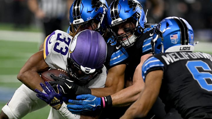 Jan 5, 2025; Detroit, Michigan, USA; Minnesota Vikings running back Aaron Jones (33) is tackled by Detroit Lions safety Kerby Joseph (31) linebacker Jack Campbell (46) and safety Ifeatu Melifonwu (6) on a third quarter run at Ford Field. Jan 5, 2025; Detroit, Michigan, USA; Minnesota Vikings running back Aaron Jones (33) is tackled by Detroit Lions safety Kerby Joseph (31) linebacker Jack Campbell (46) and safety Ifeatu Melifonwu (6) on a third quarter run at Ford Field.