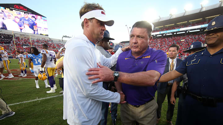 Oct 23, 2021; Oxford, Mississippi, USA; Mississippi Rebels head coach Lane Kiffin (left) and LSU Tigers head coach Ed Orgeron (right) shake hands after a game at Vaught-Hemingway Stadium. Mandatory Credit: Petre Thomas-Imagn Images Oct 23, 2021; Oxford, Mississippi, USA; Mississippi Rebels head coach Lane Kiffin (left) and LSU Tigers head coach Ed Orgeron (right) shake hands after a game at Vaught-Hemingway Stadium. Mandatory Credit: Petre Thomas-Imagn Images