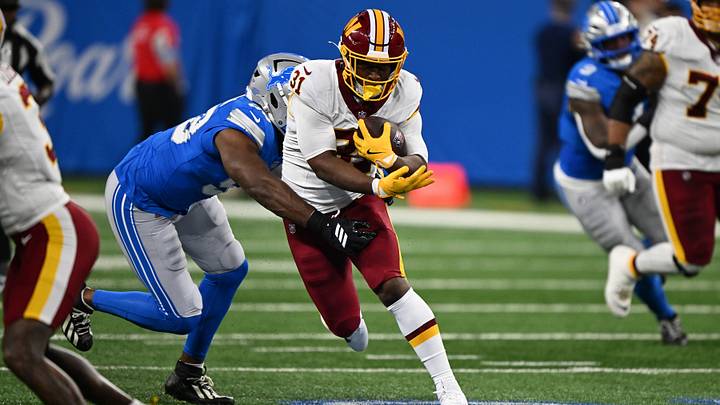 Washington Commanders running back Kaytron Allen (31) runs the ball against the  Detroit Lions in the first quarter at Ford Field.  