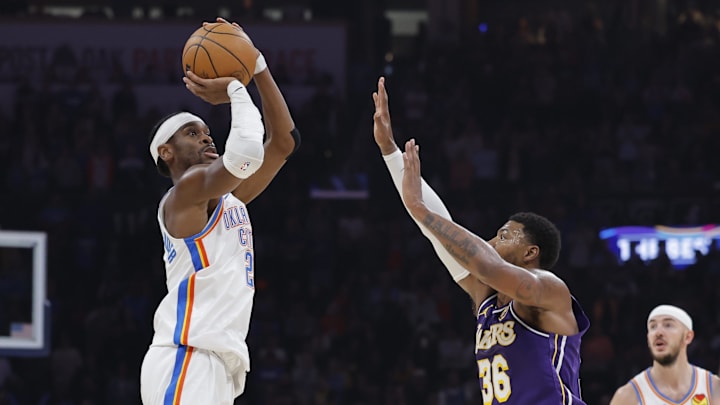 Nov 12, 2025; Oklahoma City, Oklahoma, USA; Oklahoma City Thunder guard Shai Gilgeous-Alexander (2) shoots over Los Angeles Lakers guard Marcus Smart (36) during the second quarter at Paycom Center.