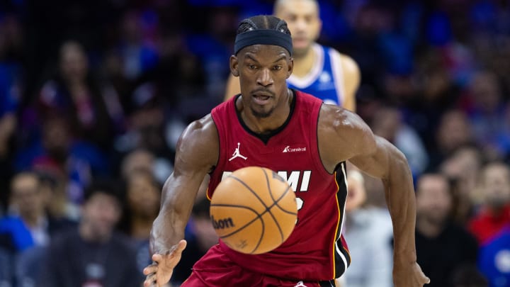 Apr 17, 2024; Philadelphia, Pennsylvania, USA; Miami Heat forward Jimmy Butler (22) picks up a loose ball against the Philadelphia 76ers during the second quarter of a play-in game of the 2024 NBA playoffs at Wells Fargo Center. Mandatory Credit: Bill Streicher-USA TODAY Sports