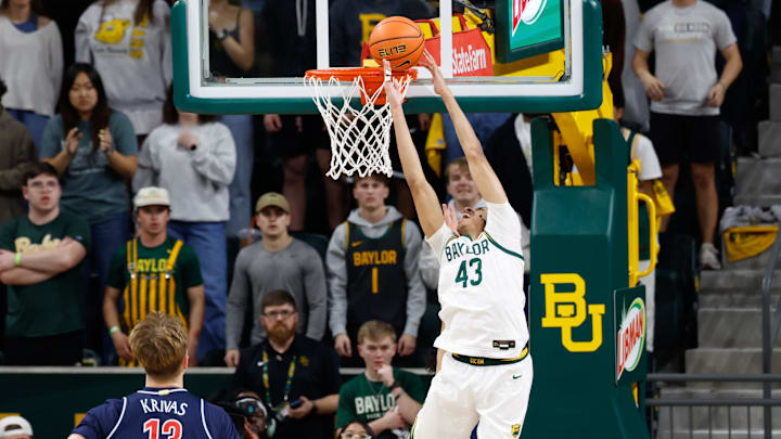 Feb 24, 2026; Waco, Texas, USA;  Baylor Bears guard Cameron Carr (43) scores a basket against Arizona Wildcats guard Brayden Burries (5) during the first half at Paul and Alejandra Foster Pavilion. Mandatory Credit: Chris Jones-Imagn Images