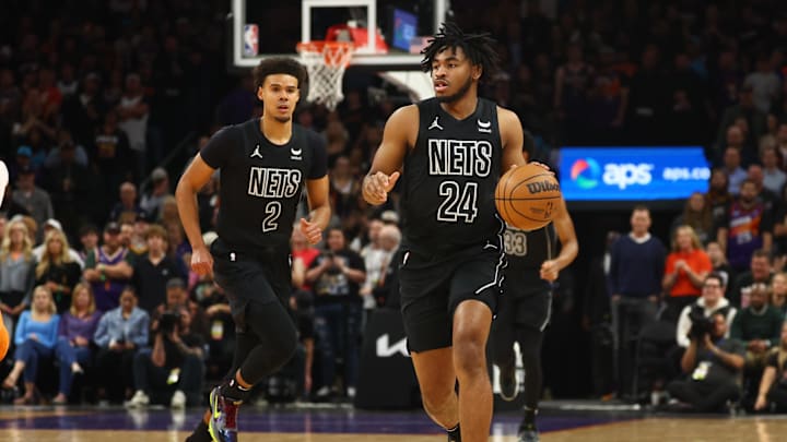 Dec 13, 2023; Phoenix, Arizona, USA; Brooklyn Nets guard Cam Thomas (24) and forward Cameron Johnson (2) against the Phoenix Suns at Footprint Center. Mandatory Credit: Mark J. Rebilas-Imagn Images