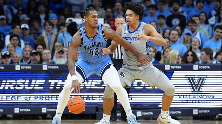 Feb 1, 2025; Philadelphia, Pennsylvania, USA; Villanova Wildcats forward Eric Dixon (43) drives against Creighton Bluejays forward Jasen Green (0) in the first half at Wells Fargo Center. Mandatory Credit: Kyle Ross-Imagn Images