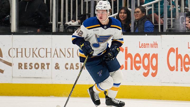 Apr 6, 2024; San Jose, California, USA; St. Louis Blues center Zach Dean (52) plays the puck against the San Jose Sharks during the first period at SAP Center at San Jose. Mandatory Credit: Robert Edwards-USA TODAY Sports