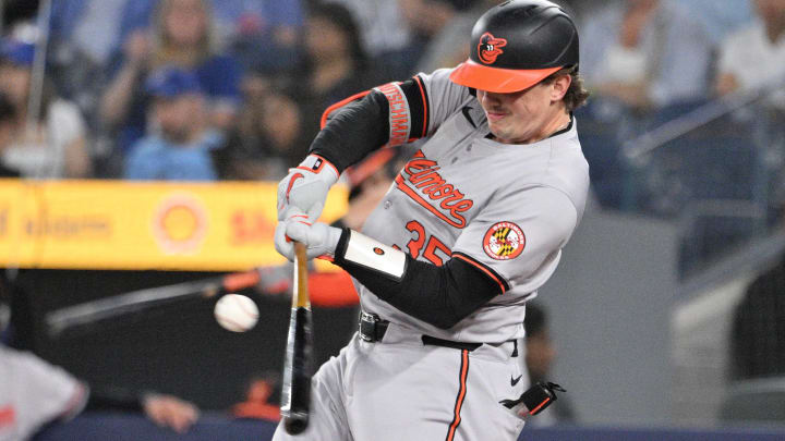 Jun 5, 2024; Toronto, Ontario, CAN; Baltimore Orioles catcher Adley Rutschman (35) hits a single. Jun 5, 2024; Toronto, Ontario, CAN; Baltimore Orioles catcher Adley Rutschman (35) hits a single.