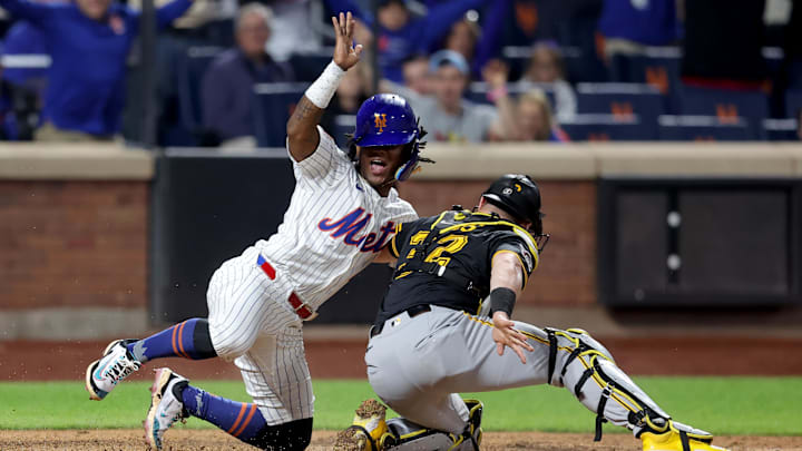 May 12, 2025; New York City, New York, USA; New York Mets second baseman Luisangel Acuna (2) reacts after scoring ahead of the tag by Pittsburgh Pirates catcher Henry Davis (32) on a single by Mets first baseman Pete Alonso (not pictured) during the seventh inning at Citi Field. Mandatory Credit: Brad Penner-Imagn Images