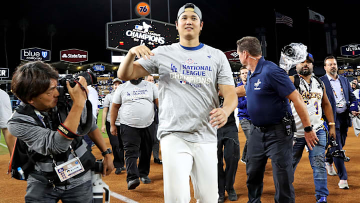 Oct 20, 2024; Los Angeles, California, USA; Los Angeles Dodgers two-way player Shohei Ohtani (17) celebrates after beating the New York Mets during game six of the NLCS for the 2024 MLB playoffs at Dodger Stadium. Mandatory Credit: Kiyoshi Mio-Imagn Images