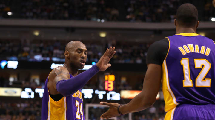 Los Angeles Lakers guard Kobe Bryant (24) celebrates with center Dwight Howard (12) in the second half against the Dallas Mavericks at the American Airlines Center.