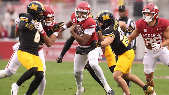 Nov 29, 2025; Fayetteville, Arkansas, USA; Arkansas Razorbacks quarterback KJ Jackson (7) rushes during the first quarter against the Missouri Tigers at Donald W. Reynolds Razorback Stadium. Mandatory Credit: Nelson Chenault-Imagn Images