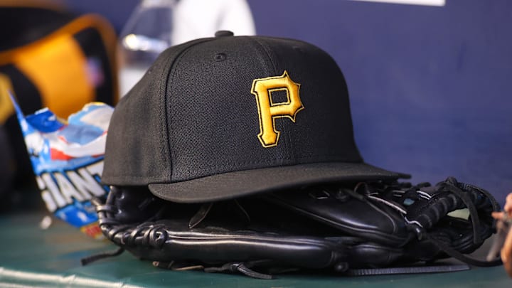 Sep 8, 2023; Atlanta, Georgia, USA; A detailed view of a Pittsburgh Pirates hat and glove before a game against the Pittsburgh Pirates in the first inning at Truist Park. Mandatory Credit: Brett Davis-Imagn Images