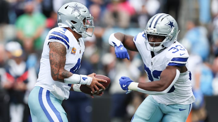 Dallas Cowboys quarterback Dak Prescott hands the ball to running back Javonte Williams. Dallas Cowboys quarterback Dak Prescott hands the ball to running back Javonte Williams.