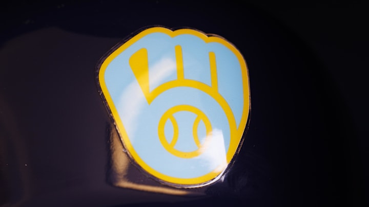 Jun 18, 2023; Milwaukee, Wisconsin, USA;  A Milwaukee Brewers logo on a batting helmet in the dugout prior to the game against the Pittsburgh Pirates at American Family Field. Mandatory Credit: Jeff Hanisch-Imagn Images