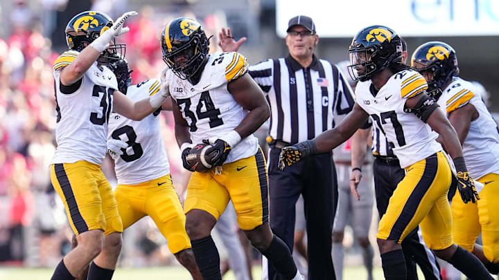 Oct 5, 2024; Columbus, OH, USA; Iowa Hawkeyes linebacker Jay Higgins (34) celebrates a fumble recovery after forcing Ohio State Buckeyes wide receiver Jeremiah Smith to lose the ball during the first half of the NCAA football game at Ohio Stadium.