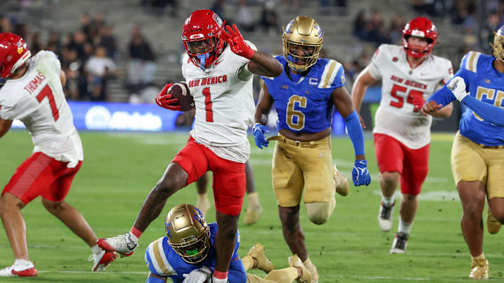 Sep 12, 2025; Pasadena, California, USA; New Mexico Lobos running back Damon Bankston (1) runs with the ball for a touchdown during the fourth quarter against the UCLA Bruins at Rose Bowl. Mandatory Credit: Kiyoshi Mio-Imagn Images Sep 12, 2025; Pasadena, California, USA; New Mexico Lobos running back Damon Bankston (1) runs with the ball for a touchdown during the fourth quarter against the UCLA Bruins at Rose Bowl. Mandatory Credit: Kiyoshi Mio-Imagn Images