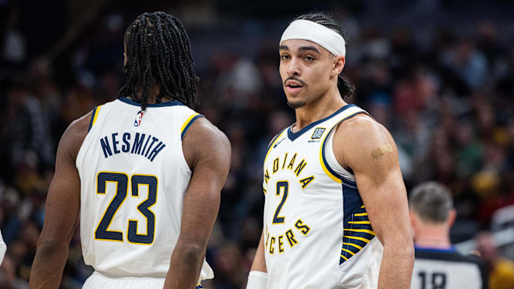 Feb 1, 2025; Indianapolis, Indiana, USA; Indiana Pacers guard Andrew Nembhard (2) celebrates with forward Aaron Nesmith (23) after a foul and basket against the Atlanta Hawks in the second half at Gainbridge Fieldhouse. Mandatory Credit: Trevor Ruszkowski-Imagn Images Feb 1, 2025; Indianapolis, Indiana, USA; Indiana Pacers guard Andrew Nembhard (2) celebrates with forward Aaron Nesmith (23) after a foul and basket against the Atlanta Hawks in the second half at Gainbridge Fieldhouse. Mandatory Credit: Trevor Ruszkowski-Imagn Images