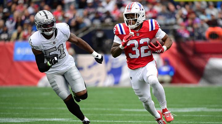 Oct 11, 2026; Foxborough, Massachusetts, USA;  New England Patriots running back TreVeyon Henderson (32) runs the ball against Las Vegas Raiders defensive end Malcolm Koonce (51) during the second quarter at Gillette Stadium.  Mandatory Credit: Bob DeChiara-Imagn Images