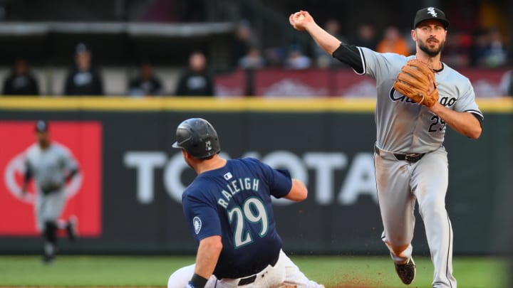 Jun 12, 2024; Seattle, Washington, USA; Chicago White Sox shortstop Paul DeJong (29) throws over Seattle Mariners catcher Cal Raleigh (29) to first base during the fourth inning at T-Mobile Park. Jun 12, 2024; Seattle, Washington, USA; Chicago White Sox shortstop Paul DeJong (29) throws over Seattle Mariners catcher Cal Raleigh (29) to first base during the fourth inning at T-Mobile Park.