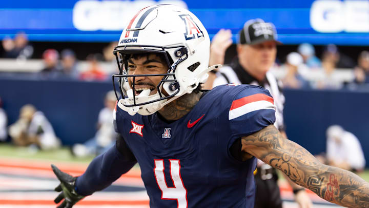 Nov 22, 2025; Tucson, Arizona, USA; Arizona Wildcats wide receiver Kris Hutson (4) celebrates against the Baylor Bears at Casino Del Sol Stadium. Mandatory Credit: Mark J. Rebilas-Imagn Images