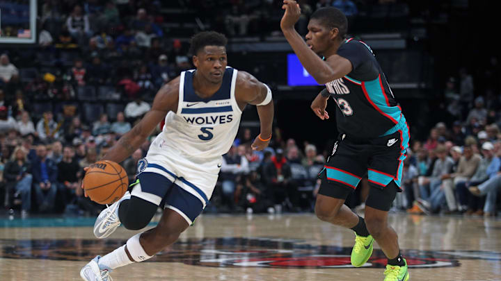 Jan 31, 2026; Memphis, Tennessee, USA; Minnesota Timberwolves guard Anthony Edwards (5) drives to the basket as Memphis Grizzlies forward Cedric Coward (23) defends during the third quarter at FedExForum.