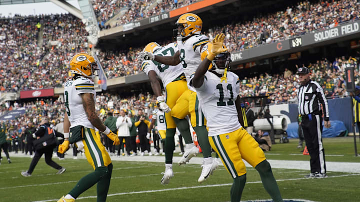 Green Bay Packers running back Josh Jacobs (8) celebrates his touchdown against the Chicago Bears.