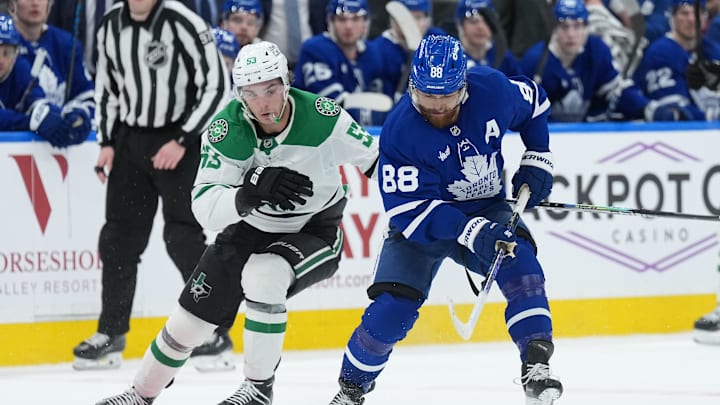 Apr 13, 2026; Toronto, Ontario, CAN; Dallas Stars center Wyatt Johnston (53) battles for the puck with Toronto Maple Leafs right wing William Nylander (88) during the third period at Scotiabank Arena. Mandatory Credit: Nick Turchiaro-Imagn Images