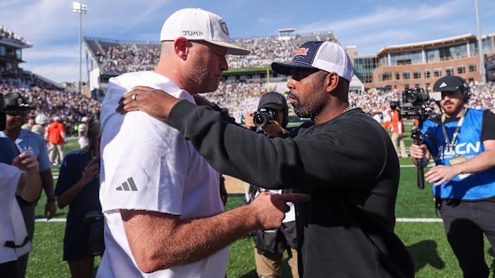 Oct 25, 2025; Atlanta, Georgia, USA; Georgia Tech Yellow Jackets head coach Brent Key talks to Syracuse Orange head coach Fran Brown after a game at Bobby Dodd Stadium at Hyundai Field. Mandatory Credit: Brett Davis-Imagn Images
