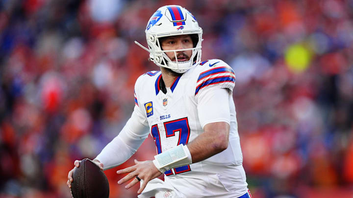 Buffalo Bills quarterback Josh Allen (17) rolls out during the second quarter of an AFC Divisional Round playoff game against the Denver Broncos at Empower Field at Mile High. 